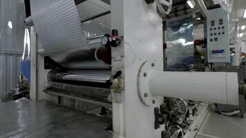 side view of large automated industrial machine for the production of metal structures and metal sheets and foil video