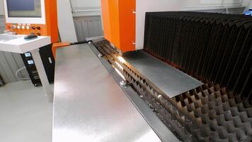 Operation of state-of-the-art computer numerical control , CNC metal laser machine, which precisely cuts circular components from sheet metal, is complex process. video