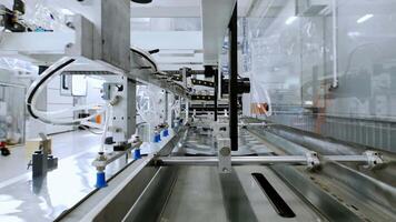 automation of production of metal sheets. Smart programmed mechanism sorts them and transfers them from conveyor video