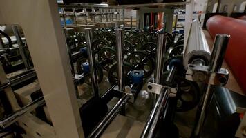 Conveyor in high-tech, automated production facility is completing its task. Lights above conveyor belts have turned off at factory. video