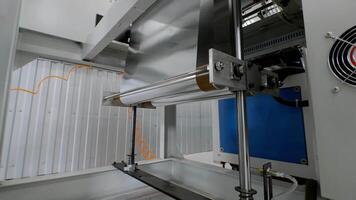 Process of coiling industrial foil into rolls. The creation of a metallized thin film on a large-scale automated conveyor system. video