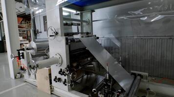 Operation of sophisticated, large-scale, professionally designed numerically controlled machine is used to produce thin, lightweight aluminum sheets. video