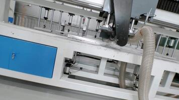 Rotating circular saw equipped with a branch pipe for chip removal is used in production conditions for cutting metal workpieces. video