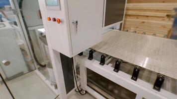 In sprawling facility equipped with state-of-the-art machinery, metal sheet was subjected to process of coating with an adhesive, resulting in pattern that resembled grid. video