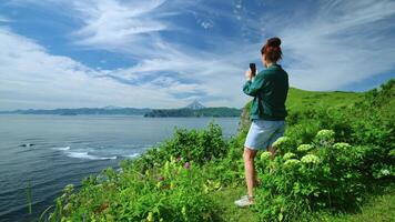 Woman Tourist Photographing Beautiful Landscape From Mount Top By Camera Of Smartphone, Back View video