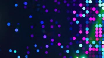 Vibrant and abstract light bokeh on a dark background, showcasing colorful circles that create a festive atmosphere. video