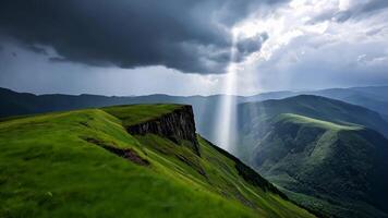 Sunbeam breaks through storm clouds over lush green mountains, symbolizing hope and renewal video