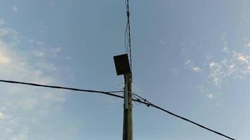A pole with wires and a light on it video