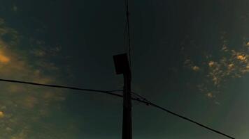 A view of a telephone pole with a cloudy sky video