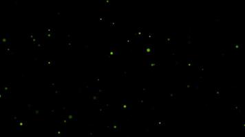 Animation loop green bokeh particles flow on black abstract background video