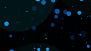 Abstract animation blue bokeh particles falling on black background video
