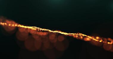 abstrato brilhando dourado onda do partículas e pontos comovente em Sombrio fundo, Magia brilhar pontos e digital fundo, 3d, 4k, desatado ciclo video