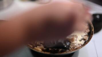 Close Up of Creamy Mushroom Sauce Being Stirred in a Frying Pan video