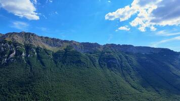 Clouds passing over majestic mountain range video
