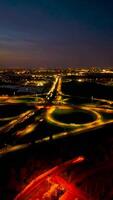 Highway aerial view. Aerial shot of elevated road junction. Drone footage of top view of Highway road junctions. The Intersecting freeway road overpass video