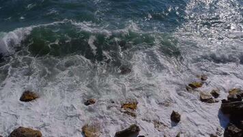 Aerial view of ocean waves and fantastic Rocky coast. Danger sea wave crashing on rock coast with spray and foam before storm video