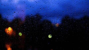 rain days, heavy rain falling on window surface, evening, the colors go out video
