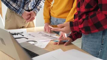 Teamwork brainstorm. Unrecognizable diverse colleagues working together discuss financial statistics. Group of people in creative office discussing business, focus on hands close up. Professional team video