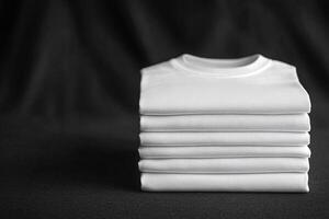 A neat stack of white t-shirts on a black background. Generated by artificial intelligence photo