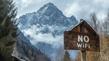 No WiFi sign or warning in front of a view of the mountains away from the city. No internet service available in the hotel. Concept of digital disconnect, digital detox, offline adventure. photo
