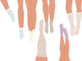 Flat set of legs in different socks lying on the floor. vector