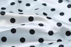 a close up of a polka dot fabric photo