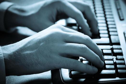 Man working on computer photo