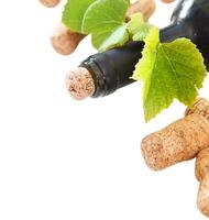 Bottle corks and bottle on the white background photo