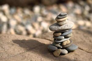 a stack of rocks sitting on top of a rock photo