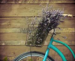 Vintage bycicle with basket with lavender photo