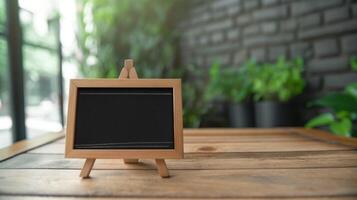 Small blackboard mockup on easel in office. Information presentation sign board template advertising image. Decorative chalkboard mock up in corporate environment product photorealistic photo