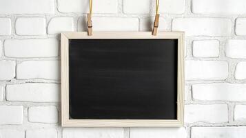 Decorative blackboard hanging on rope mockup. Notice board with wooden frame on white wall template advertising image. Chalkboard mock up in interior product photorealistic photo