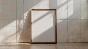 Minimalist wooden frame mockup on tiled wall with shadows. Neutral tones poster photoframe template advertising image. Contemporary pictureframe mock up product photorealistic photo