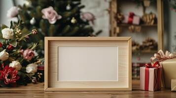 Horizontal wooden frame mockup on festive table adorned with presents flowers. Blurred Christmas tree pictureframe template advertising image. Warm holiday ambiance photoframe mock up photo