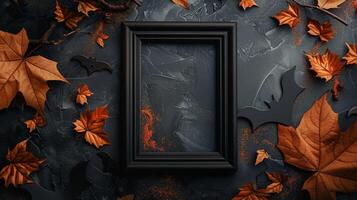 Vertical black frame mockup with orange autumn leaves and bat silhouettes. Spooky autumnal Helloween pictureframe template advertising image. Haloween photoframe mock up photorealistic photo