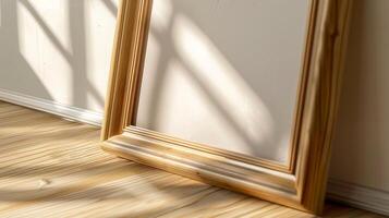 Empty wooden frame mockup in natural sunlight. Pictureframe on light wood floor template advertising image. Minimalist calm. Soft shadows casting on border mock up product photorealistic photo