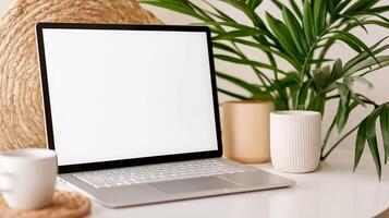 Mockup laptop screen with houseplants and wicker mat. Home office with notebook computer template advertising image. Glowing screen mock up in workplace product photorealistic photo