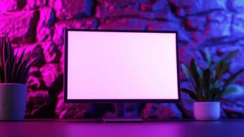 Monitor mockup with pot plants neat rock wall. Pc screen template in modern office with neon light advertising image. E commerce technology screen mock up product photorealistic photo