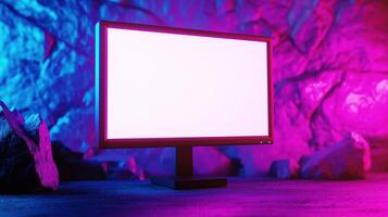 Working computer monitor mockup by rock wall. Powerful gaming pc in stylish neon interior template advertising image. Internets technology device screen mock up product photorealistic photo