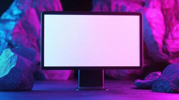 Modern computer screen mockup among rocks. Neon glowing cave with digital device template advertising image. Surrealistic scene with pc monitor mock up product photorealistic photo