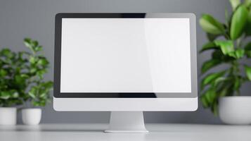 Computer monitor mockup and pot plants on white desk. Office pc screen template with houseplants advertising image. Modern digital device mock up display product photorealistic photo