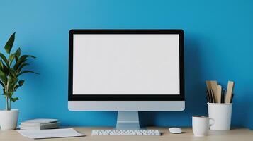 Workplace with computer monitor mockup on office supplies. Pc workstation on desk near blue wall template advertising image. Digital technology display mock up product photorealistic photo