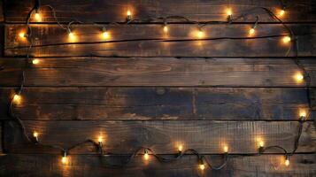Glowing fairy lights on rustic desk banner background copy space. Wooden tabletop with garland image backdrop empty. Showcase decor concept composition top view, copyspace photo