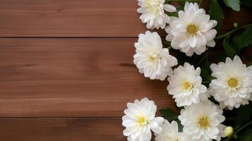 Fresh flowers bouquet on textured wooden table banner background copy space. Festive floral decor on desk image backdrop empty. Blossom concept composition top view, copyspace photo
