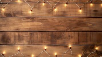 Festive lights on wooden tabletop banner background copy space. Holiday garland frame on display image backdrop empty. Products promo concept composition top view, copyspace photo