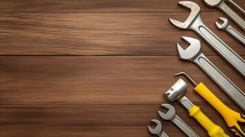 Manual tools collection on wooden workbench banner background copy space. Spanners and hammer frame image backdrop empty. Maintenance service concept composition top view, copyspace photo