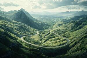 Scenic winding road through lush green hills under a cloudy sky in the afternoon light photo