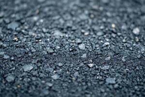 Close-up view of freshly laid asphalt showing texture and detail on a road surface photo