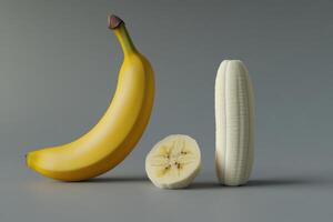 Illustration of a whole banana, a split banana, and a banana slice on a neutral gray background photo