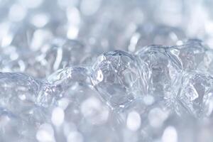 Clear bubbles floating on a surface with soft lighting create an ethereal atmosphere photo
